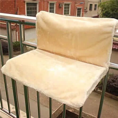 Cat bed cat hammock on a balcony, plush material for feline comfort and relaxation.