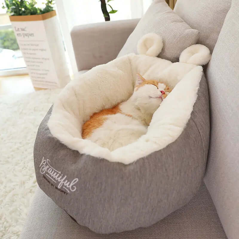 Pet cat Bed Warming Soft Sleeping Bag Cushion Puppy Kennel with a cozy cat sleeping peacefully inside.