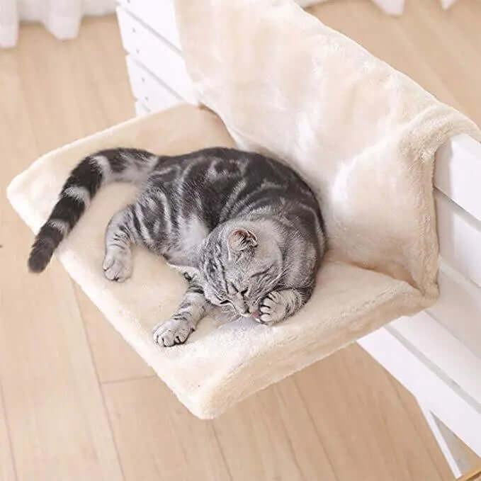 Cat bed cat hammock with a cozy plush surface, providing a comfortable resting spot for a sleeping cat.